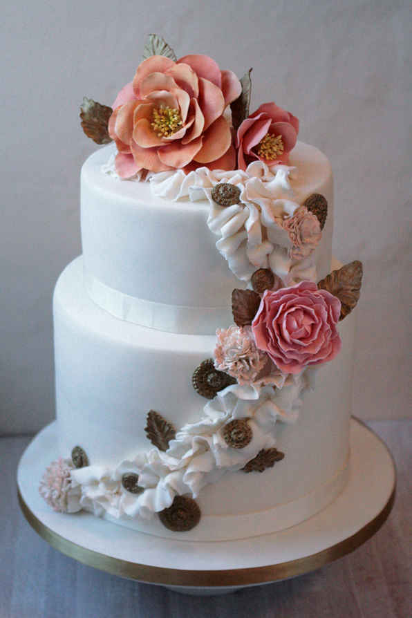 With double height bottom tier ruffles hand tinted sugar flowers 